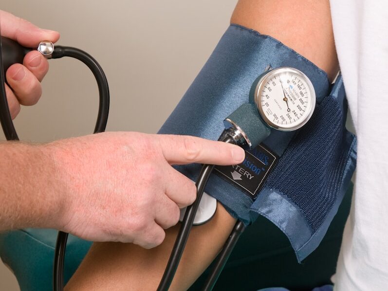 a doctor checking the blood pressure of a patient