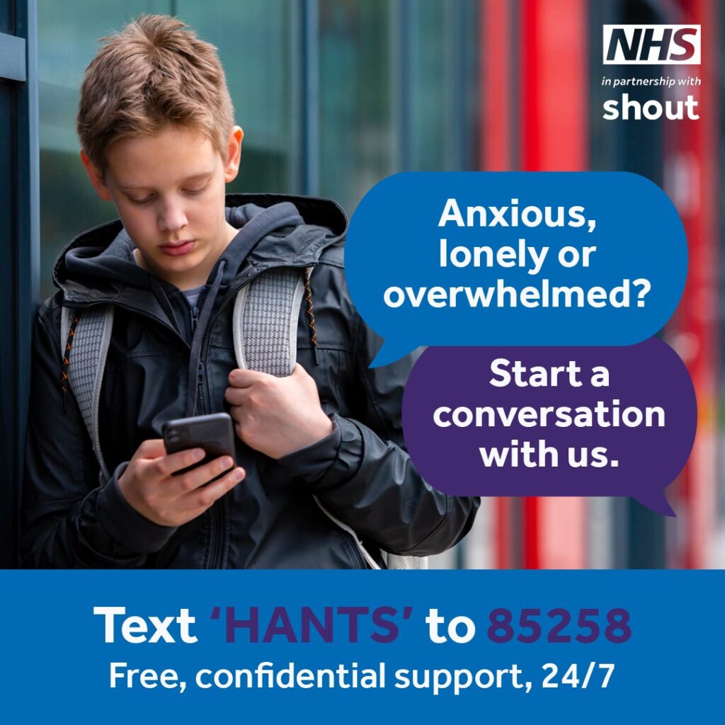 image of boy looking worried and holding a phone. Wording says "Anxious, lonely or overwhelmed? Start a conversation with us. Test 'HANTS' to 85258 for free, confidential support, 24/7.