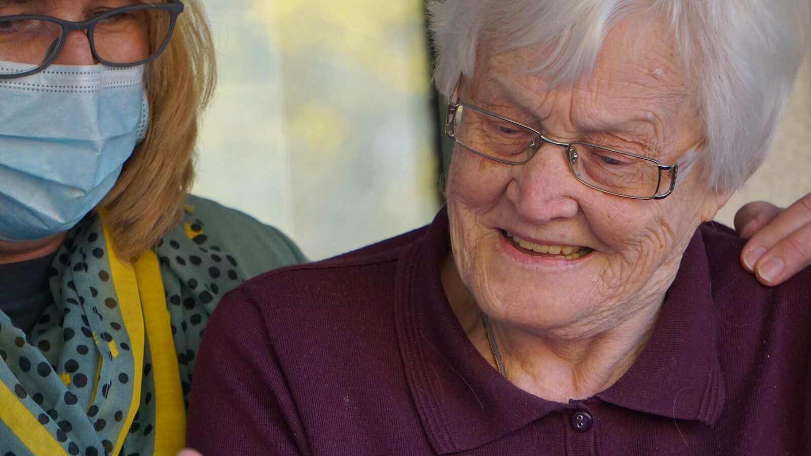 woman in purple polo shirt wearing eyeglasses