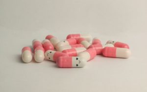 pink and white medication pill