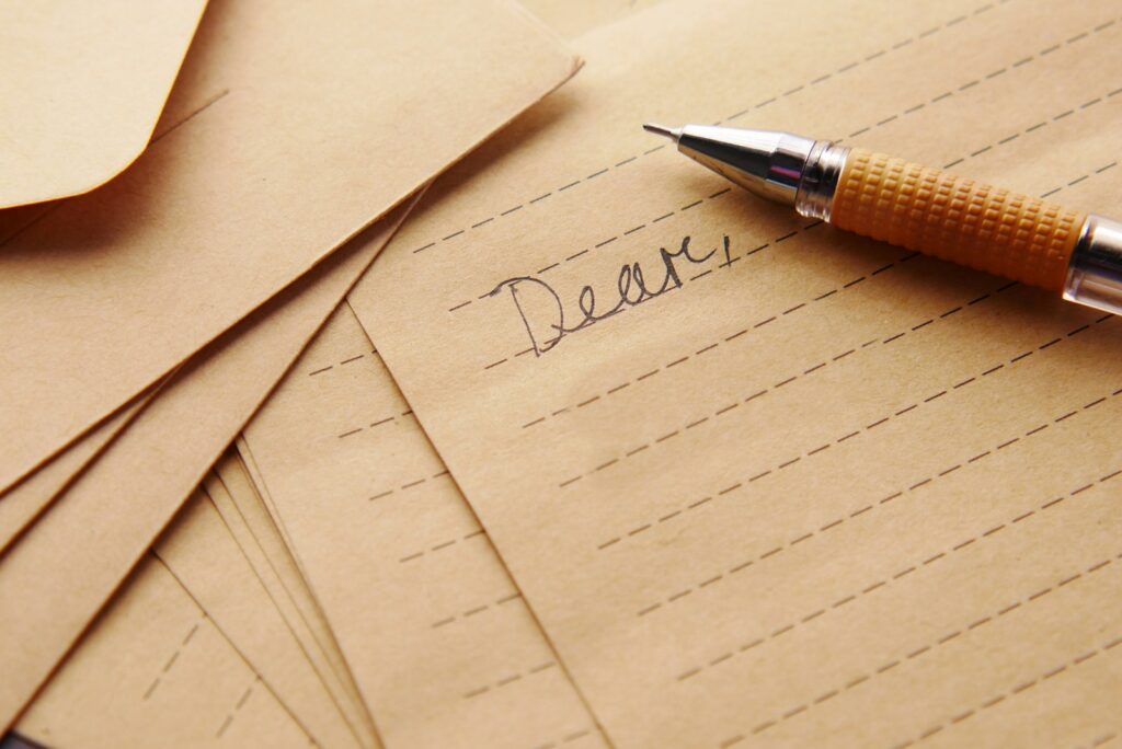 a pen sitting on top of a piece of paper