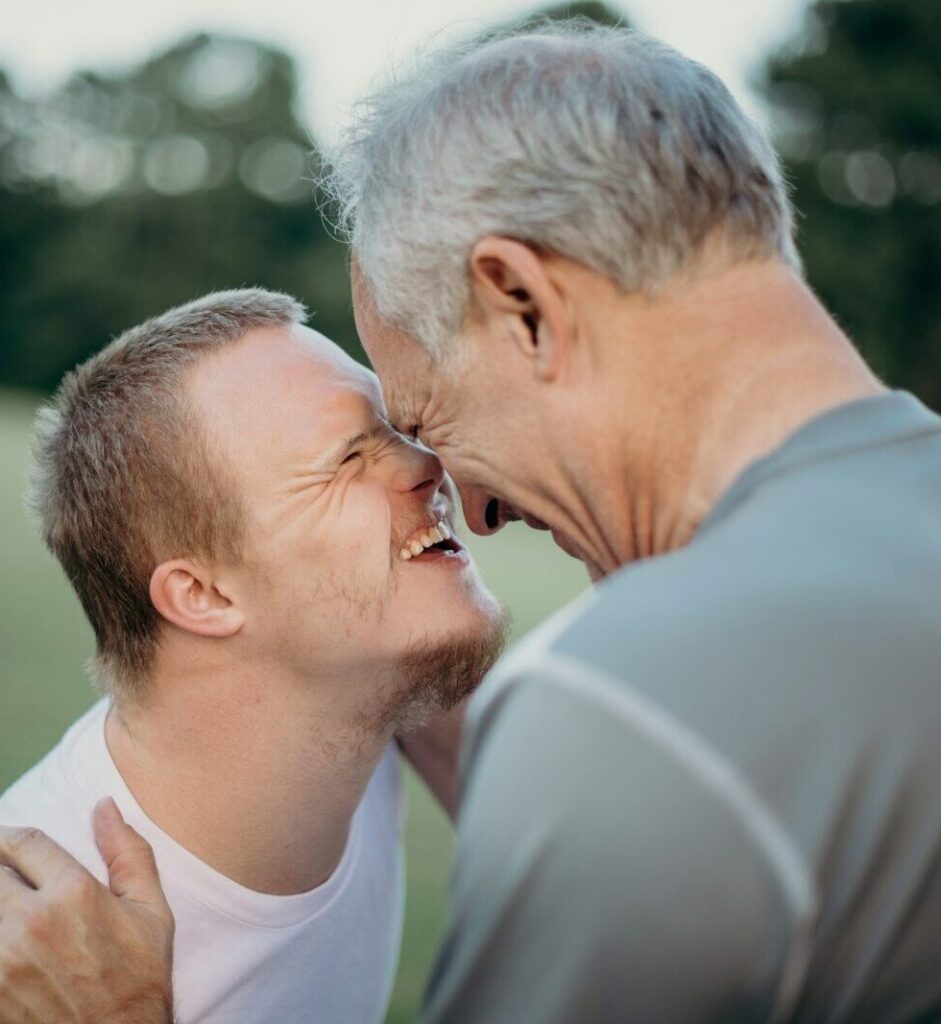 two man talking to each other on grass field