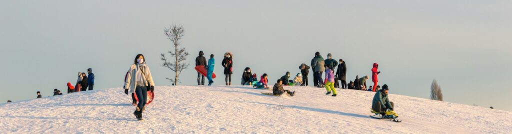 a group of people standing on top of a snow covered slope