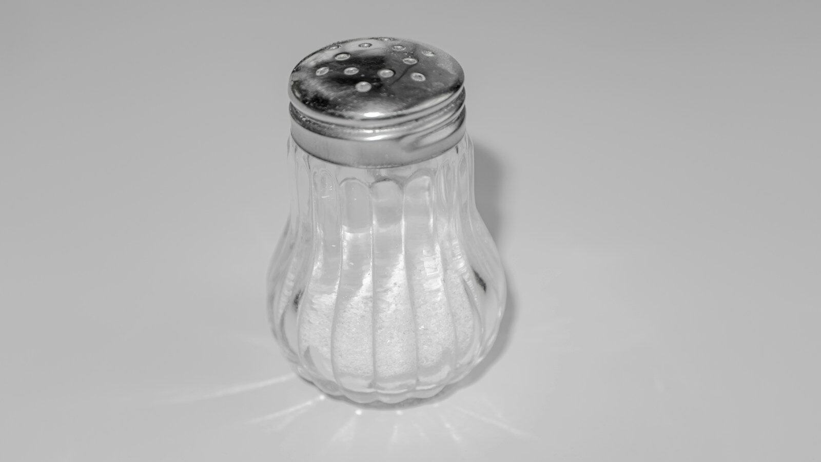 a salt shaker sitting on top of a table