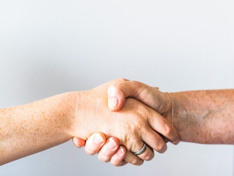 person holding hands of another person