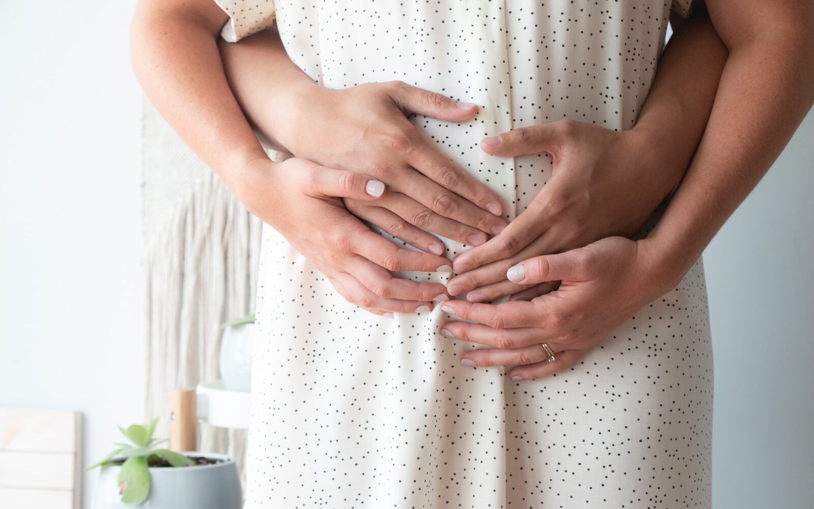 person touching person's belly