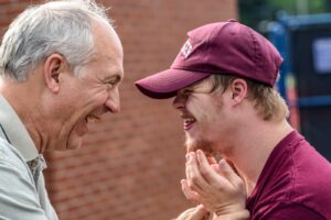 two men laughing at each other