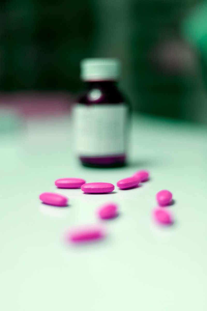 a bottle of pills sitting on top of a table
