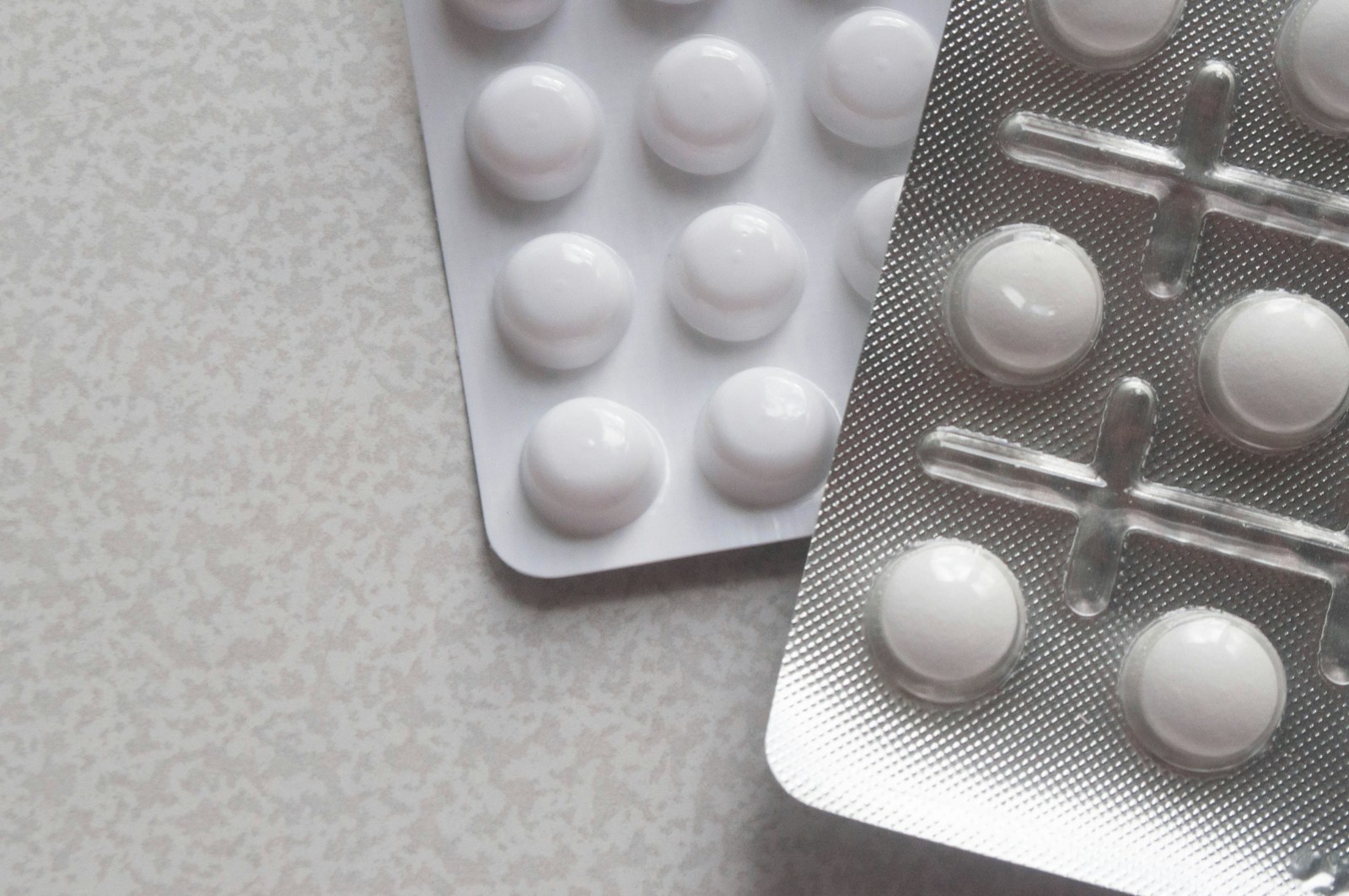 a pack of pills next to a contraption on a table