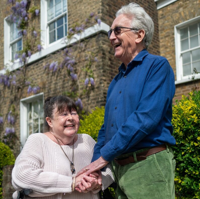 a man and a woman standing outside