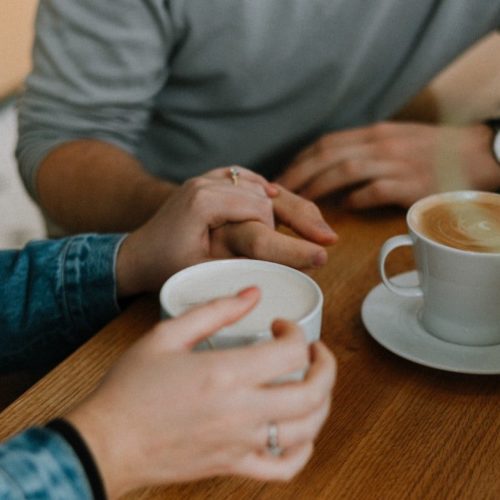 two mugs with coffee on table