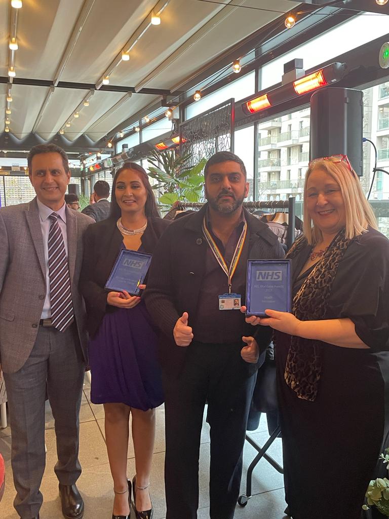 Some of NHC's staff and board members hold their award at the event.