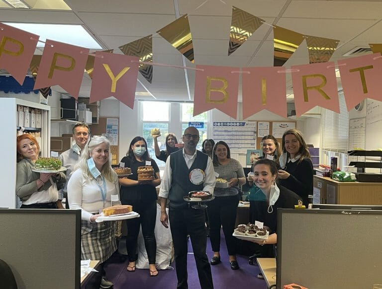 Image of staff at Bromleag Care Practice celebrating their 2nd birthday